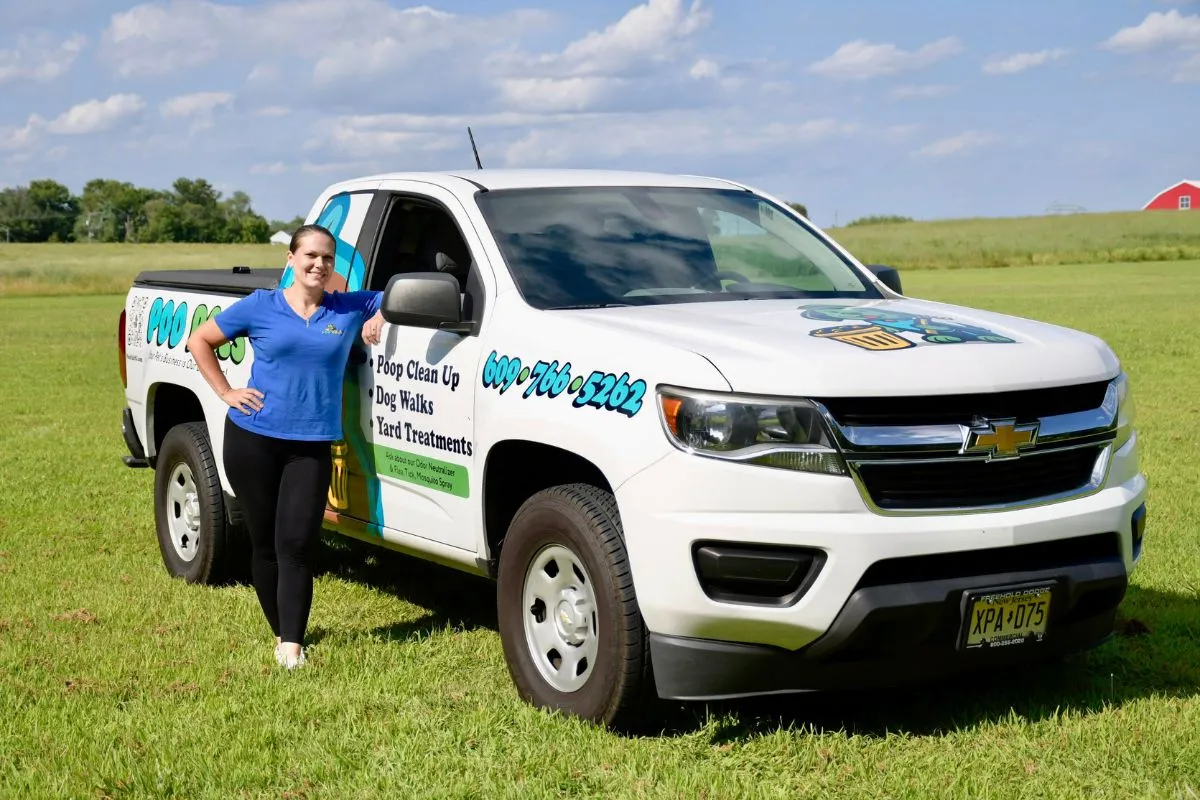 Cassie with Poo Pals service truck in Toms River